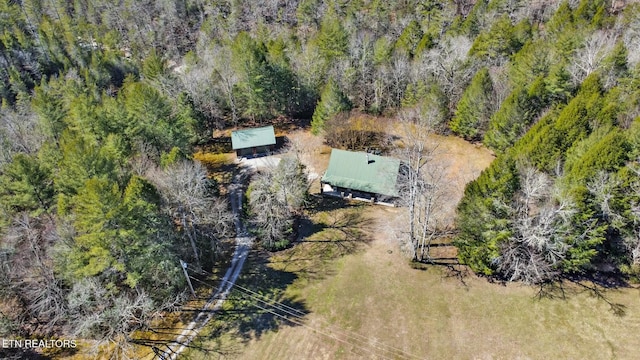 birds eye view of property with a wooded view