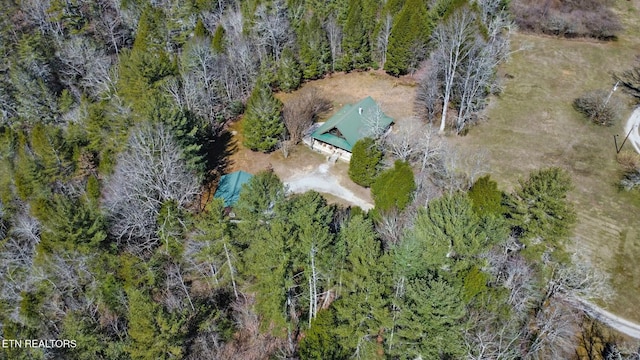 drone / aerial view featuring a forest view