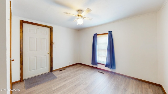 unfurnished room featuring crown molding, light hardwood / wood-style floors, and ceiling fan