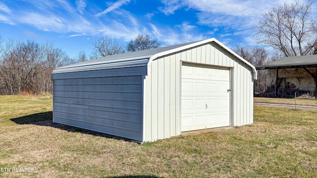 garage featuring a lawn