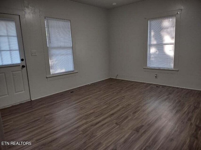 entryway with dark hardwood / wood-style flooring