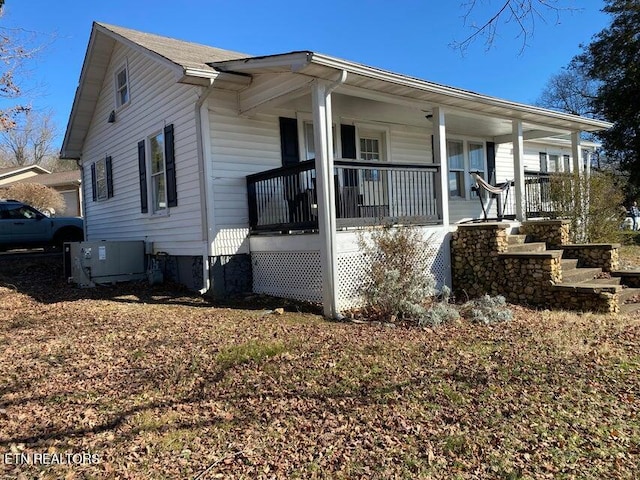 view of property exterior featuring central AC and covered porch