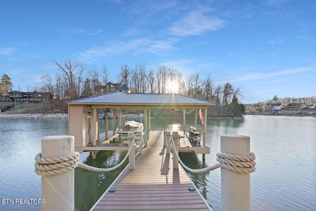 dock area featuring a water view and boat lift