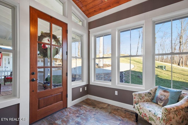 sunroom / solarium with visible vents and wood ceiling