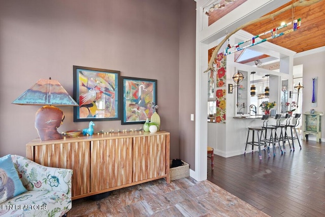 interior space with wood finished floors and baseboards