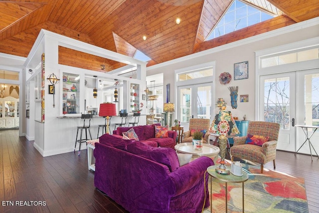 living area with high vaulted ceiling, french doors, wooden ceiling, and crown molding