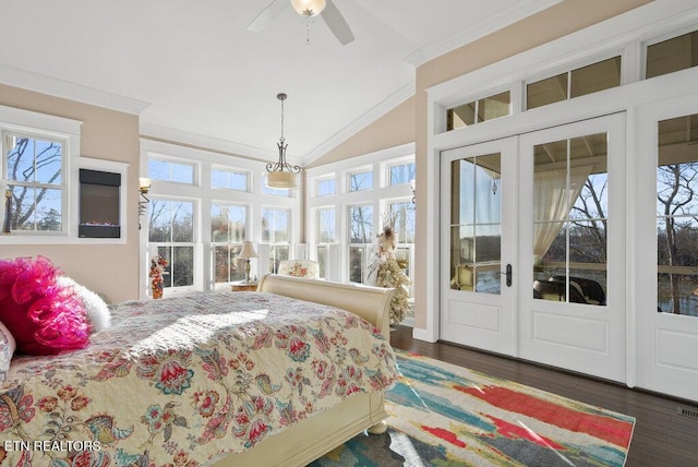 bedroom with access to exterior, french doors, dark wood finished floors, crown molding, and lofted ceiling