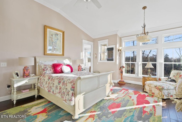 bedroom with vaulted ceiling, ornamental molding, wood finished floors, and baseboards