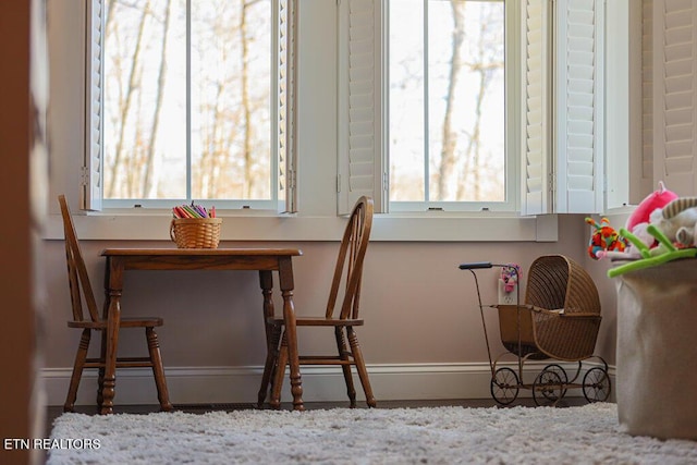 dining room with a wealth of natural light and baseboards