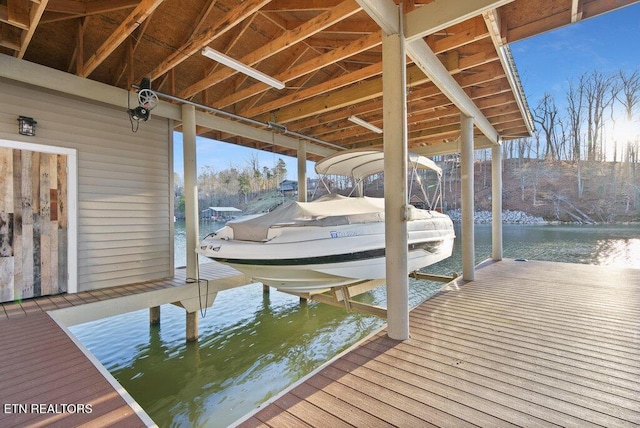 view of dock featuring a water view and boat lift