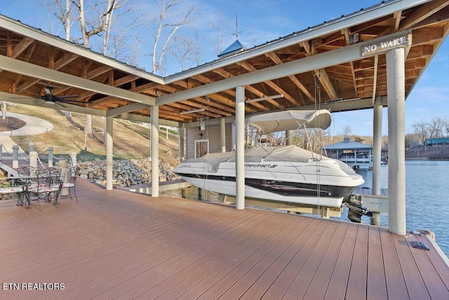 dock area featuring a water view and boat lift