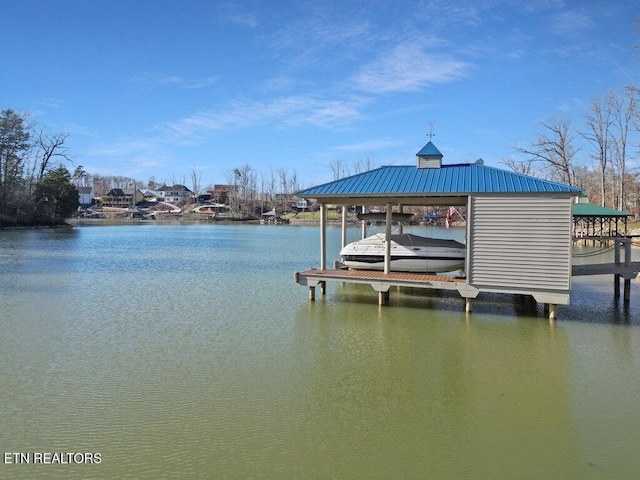 view of dock featuring a water view and boat lift