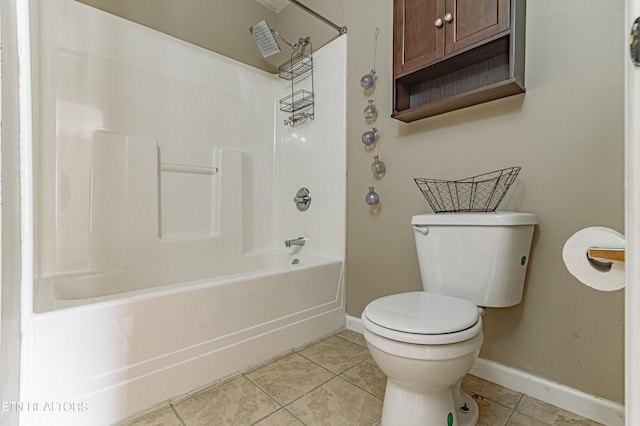 bathroom with tile patterned flooring, shower / tub combination, and toilet