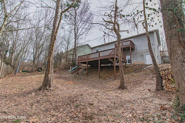 rear view of house with a wooden deck