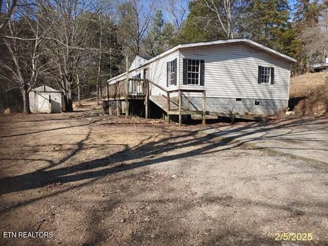 view of home's exterior with a shed