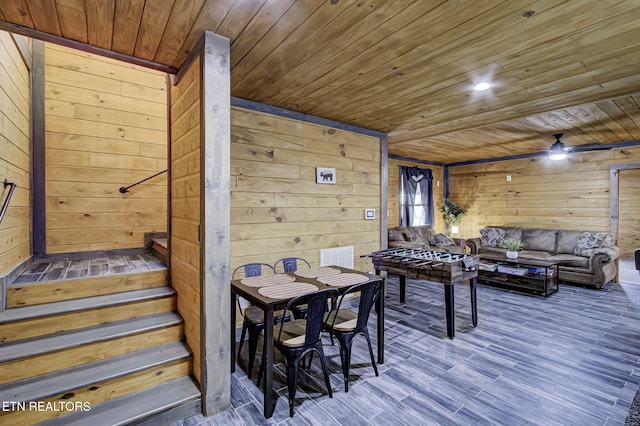 playroom featuring hardwood / wood-style flooring, ceiling fan, wooden ceiling, and wooden walls