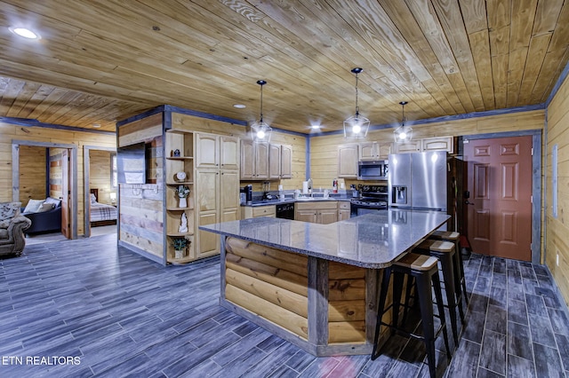 kitchen featuring a center island, wooden ceiling, wooden walls, and black appliances