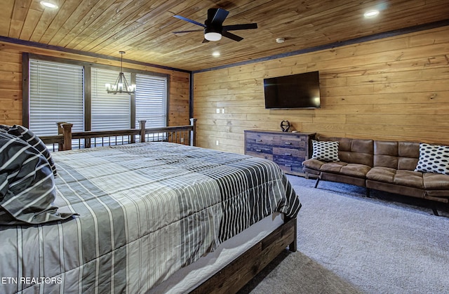 carpeted bedroom with ceiling fan with notable chandelier, wooden ceiling, and wood walls