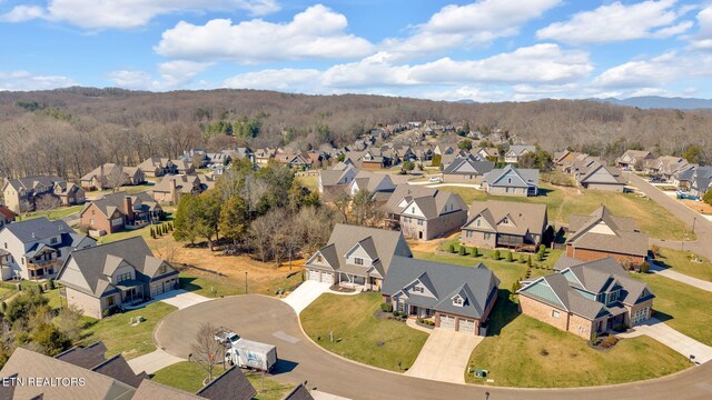 birds eye view of property with a residential view