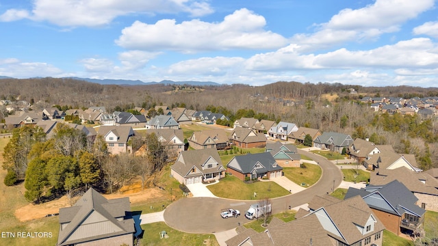 aerial view featuring a mountain view and a residential view