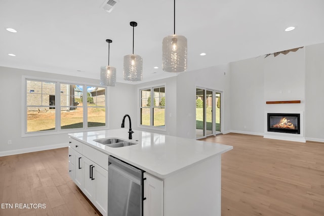 kitchen with visible vents, dishwasher, recessed lighting, light wood-style floors, and a sink