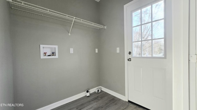 clothes washing area featuring hardwood / wood-style flooring and hookup for a washing machine