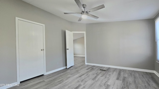 unfurnished bedroom featuring light hardwood / wood-style flooring and ceiling fan