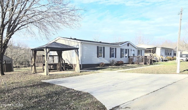 view of property exterior featuring a gazebo and a yard