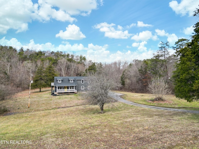 exterior space featuring a porch and a front lawn