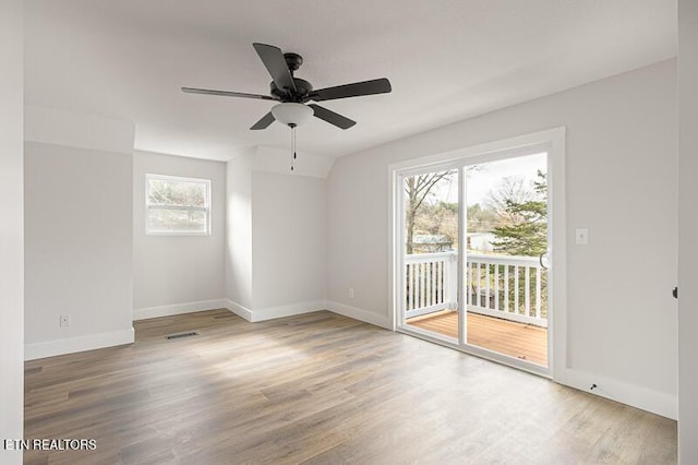 empty room featuring hardwood / wood-style flooring and ceiling fan