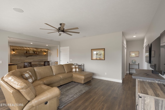 living room featuring recessed lighting, dark wood finished floors, baseboards, and ceiling fan