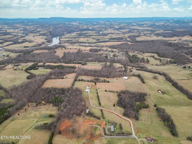 aerial view with a rural view and a water view