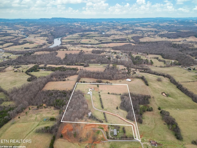 aerial view with a rural view and a water view