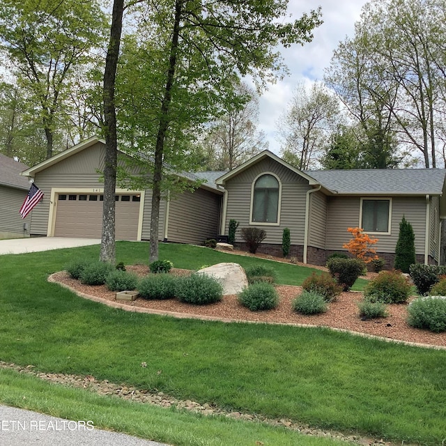 ranch-style home with a garage, concrete driveway, and a front yard