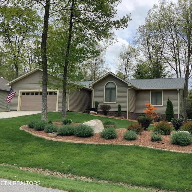 ranch-style house with an attached garage, concrete driveway, and a front yard