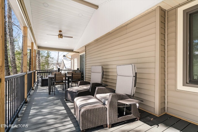 deck with ceiling fan and outdoor dining space