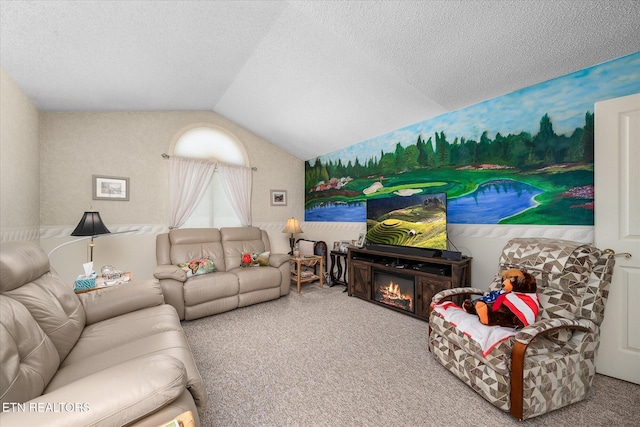 carpeted living area with vaulted ceiling and a textured ceiling