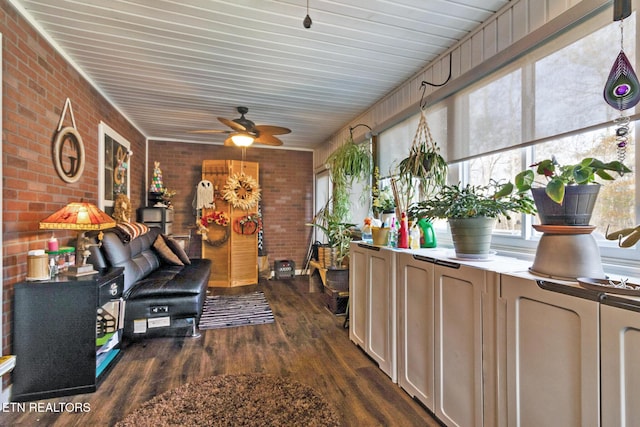 sunroom / solarium featuring ceiling fan