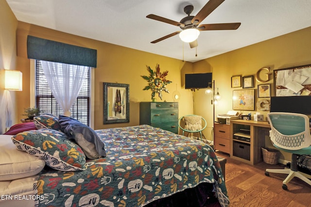 bedroom with hardwood / wood-style flooring and ceiling fan