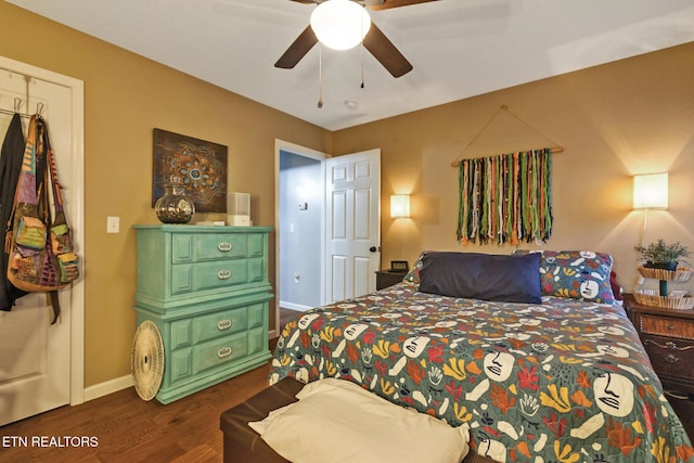 bedroom featuring ceiling fan and dark hardwood / wood-style flooring