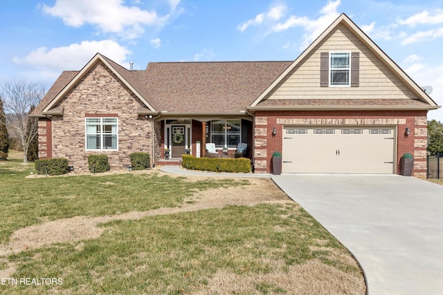 craftsman-style home with a garage, covered porch, and a front lawn