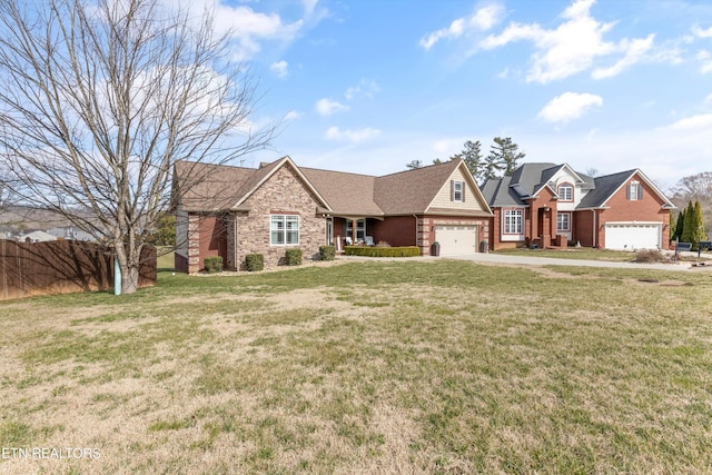 view of front of home featuring a garage and a front yard