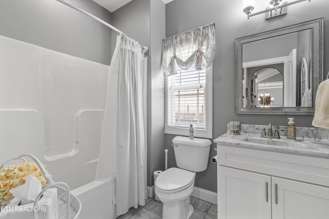 full bathroom featuring shower / bath combo with shower curtain, vanity, and toilet