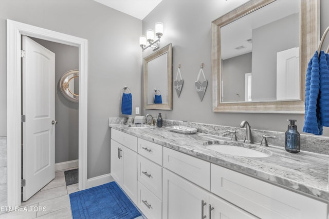 bathroom featuring tile patterned floors and vanity