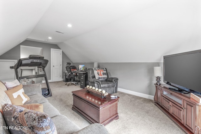 living room featuring vaulted ceiling and light colored carpet