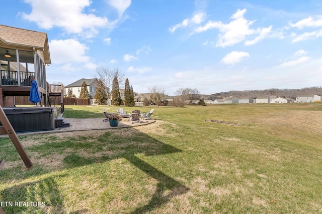 view of yard with an outdoor fire pit, a patio, and a hot tub