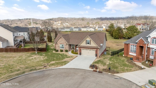 view of front of house featuring a front lawn and a garage