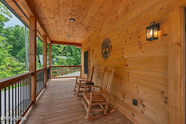 wooden deck featuring covered porch