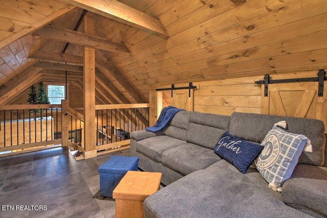 unfurnished living room featuring wooden ceiling, a barn door, lofted ceiling with beams, and wood walls