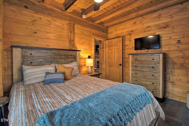 bedroom with beamed ceiling, wood ceiling, and wood walls